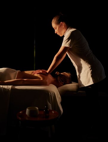 Therapist performing a wellness treatment on a guest at Aman's spa in the Dominican Republic.