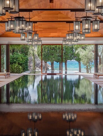Spa pool at Aman Sveti Stefan overlooking the Adriatic Sea through open arches.