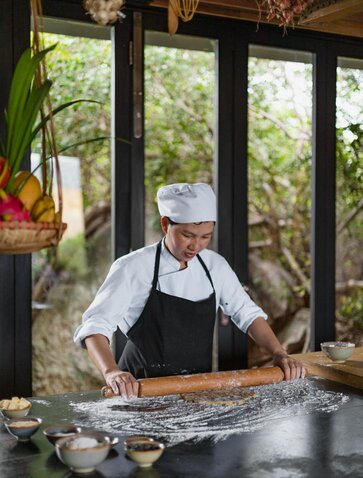 Chef preparing ingredients at Amanoi's cooking class in Vietnam.