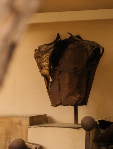 Studio portrait of a bronze sculptural torso at Amanzoe, Greece art exhibit.