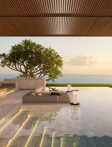 Sky Villa pool overlooking Singapore's skyline at sunset, with tree and loungers.