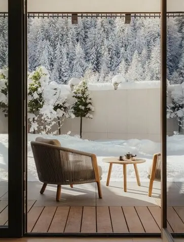 Zen garden spa bath with forest view at Aman Rosa Alpina resort.