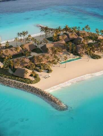 Double Beach Island Residence at Amanolu, aerial view of sandy shores and turquoise waters.