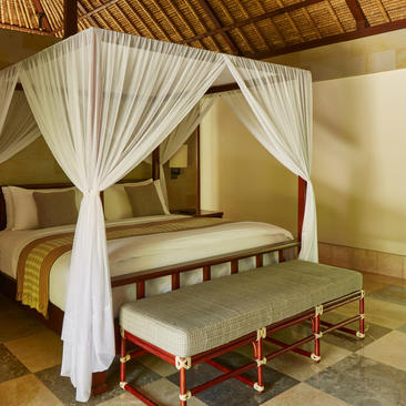 Principal bedroom with four-poster canopy bed at Aman Villas at Nusa Dua, Bali.