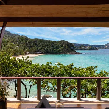 Ocean Pavilion at Amanpuri overlooking turquoise waters and coastal hills, Thailand.