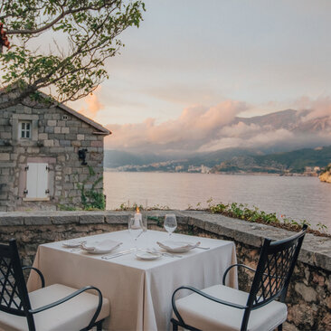 St. Sava Cottage dining terrace overlooking the Adriatic Sea at Aman Sveti Stefan, Montenegro.