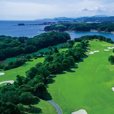 Amanemu golf course fairway overlooking coastal islands and forested landscape in Japan.