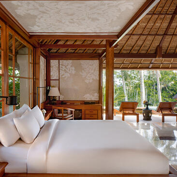 Principal bedroom at Amandari with wooden pavilion architecture and garden views.