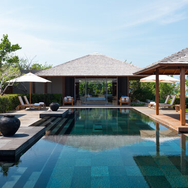 Four-bedroom ocean villa at Amanyara with infinity pool, loungers and tropical gardens.