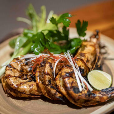 Grilled prawns with fresh coriander and lime at Aman Villas at Nusa Dua.