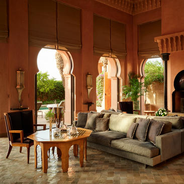 Al Hamra Suite with arched doorways opening to gardens at Amanjena resort, Marrakech.
