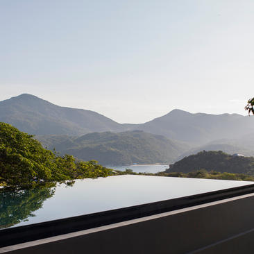 Four-bedroom villa at Amanoi with views over mountains and water.