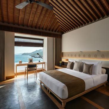 Principal bedroom with wooden ceiling and sea view at Amanoi, Vietnam.