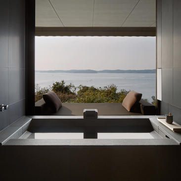 Soaking tub at Amanemu with views across Matsushima Bay towards distant islands.