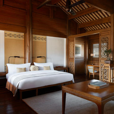 Principal bedroom at Amandayan with four-poster bed, wooden furnishings, and traditional architectural details.
