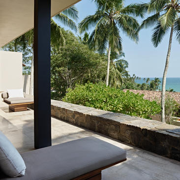 Principal bedroom with ocean view towards tropical gardens at Amanwella.
