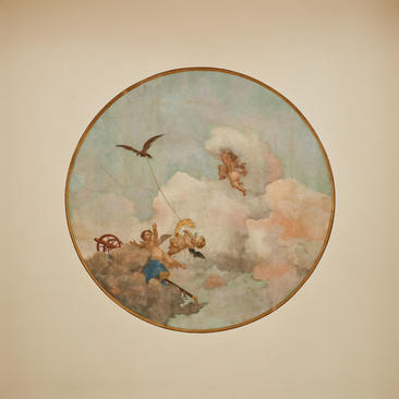 Circular ceiling fresco depicting cherubs among clouds in Coccina's apartment at Aman Venice.