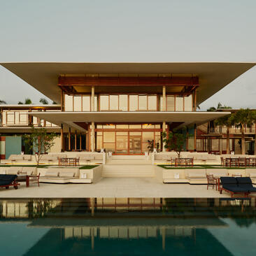 Casa Grande exterior at Amanera, with modernist architecture and reflecting pool.