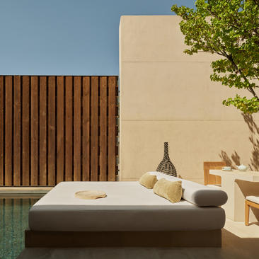 Mesa pool suite with sunbed overlooking water feature at Amangiri resort, USA.