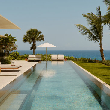 Two-bedroom casa at Amanera with infinity pool overlooking turquoise Caribbean waters.