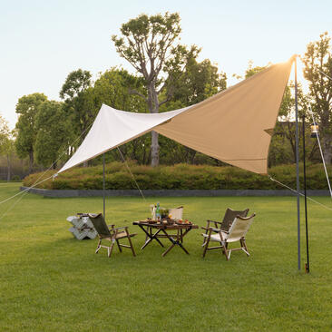Tent al fresco dining setup at Amanyangyun, with table and chairs beneath canvas canopy on lawn.