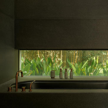 Ming Pavilion accommodation at Amanyangyun with views of bamboo forest through window.