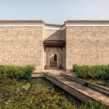 Four-bedroom villa entrance at Amanyangyun with brick façade and wooden bridge approach.