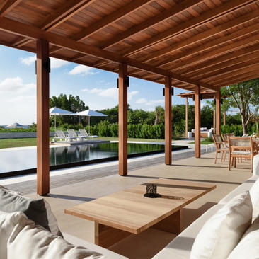 Five-bedroom beach sala villa at Amanyara with covered terrace overlooking tropical gardens and water.