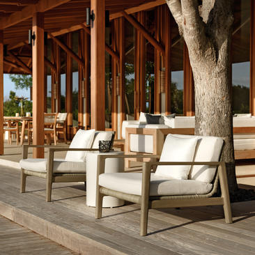 Five-bedroom beach villa sala at Amanyara with wooden seating area overlooking Turks and Caicos.