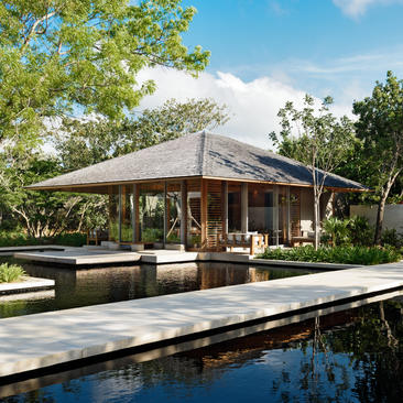 Five-bedroom beach sala villa at Amanyara with reflecting pool and tropical landscaping.