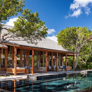Four-bedroom villa with wooden pavilion overlooking an infinity pool at Amanyara, Turks and Caicos.
