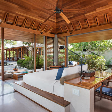Four-bedroom villa with open-sided pavilion, wooden ceiling, and direct beach path access at Amanyara.
