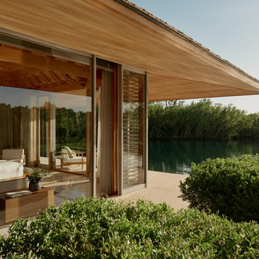 Four-bedroom villa at Amanyara with wooden pergola and landscaped gardens in Turks and Caicos.