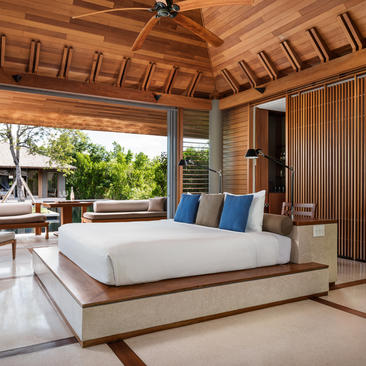 Six-bedroom beach sala villa principal bedroom at Amanyara, Turks and Caicos, with wooden ceiling and ocean views.