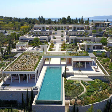 Villa exterior with plunge pool and gardens at Amanzoe resort, Porto Heli, Greece.