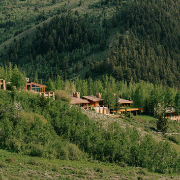 Amangani residences scattered across a forested mountainside in Jackson Hole.