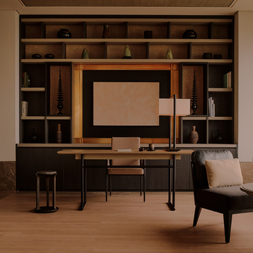 Aman Nai Lert Bangkok suite with built-in wooden cabinetry, desk workspace, and grey armchair.