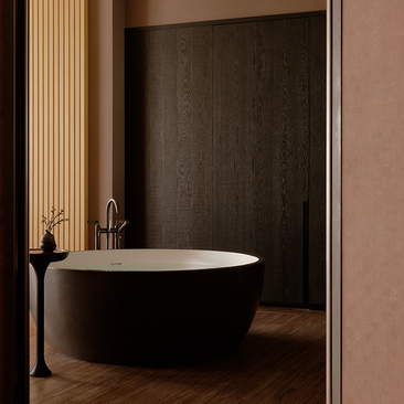 Contemporary bathroom at Aman Nai Lert Bangkok with freestanding black bathtub and warm wood tones.
