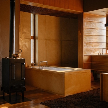 Wooden bathroom suite at Amankora with soaking tub and heated towel rail.