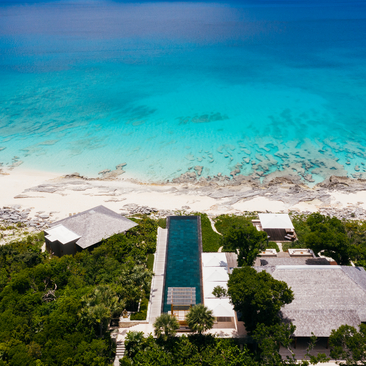 Five-bedroom villa at Amanyara with direct beach access and infinity pool overlooking turquoise waters, Turks and Caicos.