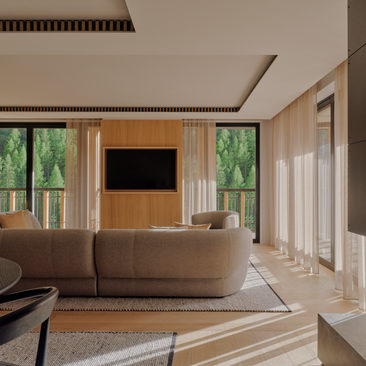 Aman Rosa Alpina suite sitting area with curved sofa, wooden media unit, and floor-to-ceiling windows overlooking Italian landscape.