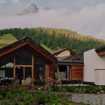 Zeno Suite at Aman Rosa Alpina resort with mountain views and Alpine landscape.