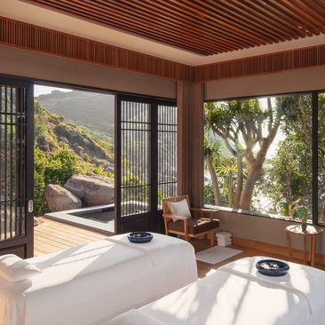 Double treatment room at Amanoi with views towards the ocean and surrounding landscape, Vietnam.