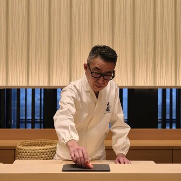 Chef preparing sushi at Musashi, the Japanese dining venue at Aman Tokyo.