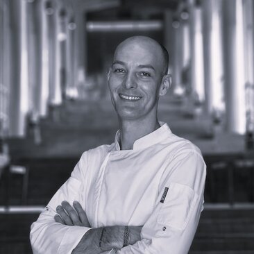 Chef Ray at Amanoi, black and white portrait photograph.