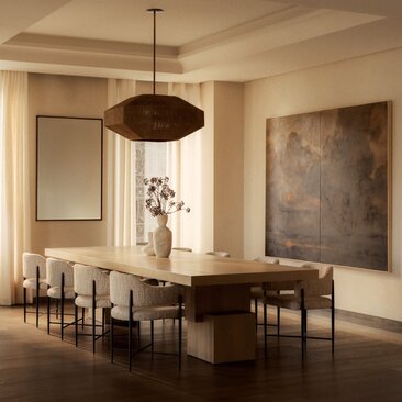Spacious dining area at Aman New York with wooden table, mid-century chairs, and large pendant light.