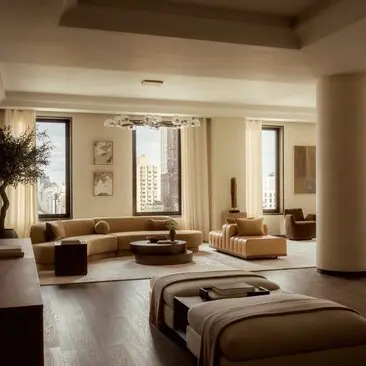 Spacious penthouse living area at Aman New York with floor-to-ceiling windows, neutral tones, and modern furnishings.