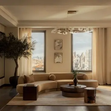 Three-bedroom penthouse living room at Aman New York with floor-to-ceiling windows overlooking the city skyline, curved seating, and natural light.