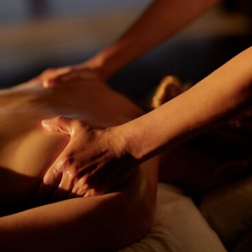 Therapeutic massage hands at Amanera resort wellness spa, Dominican Republic.