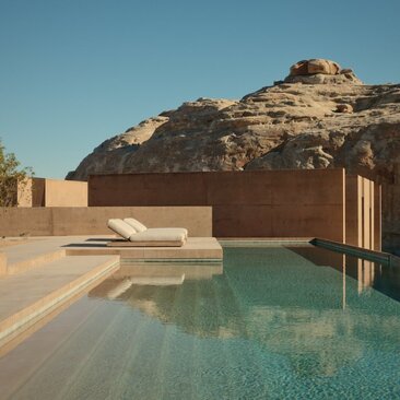Six-bedroom villa with plunge pool overlooking desert rock formation at Amangiri, Utah.